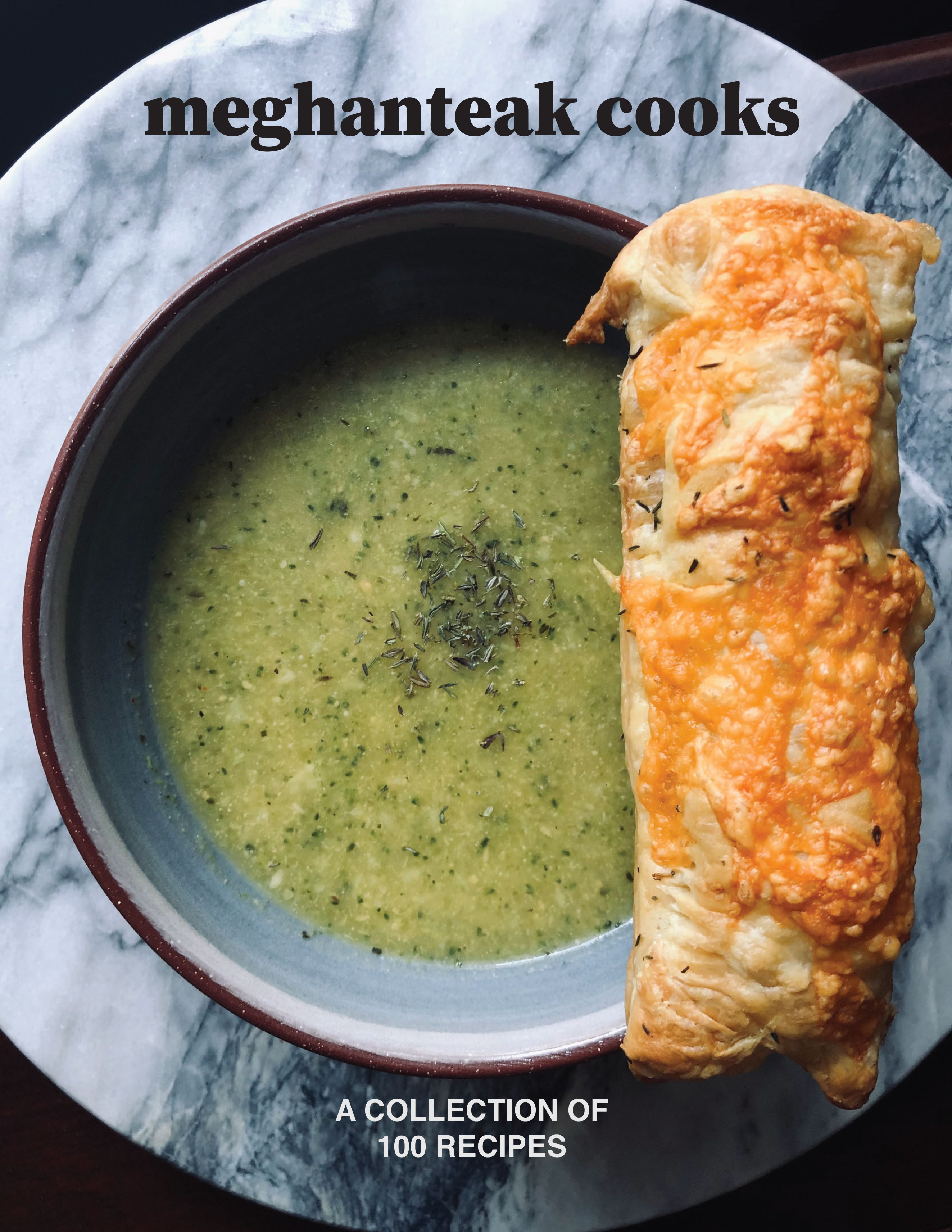 A cookbook with an image of a bowl of soup