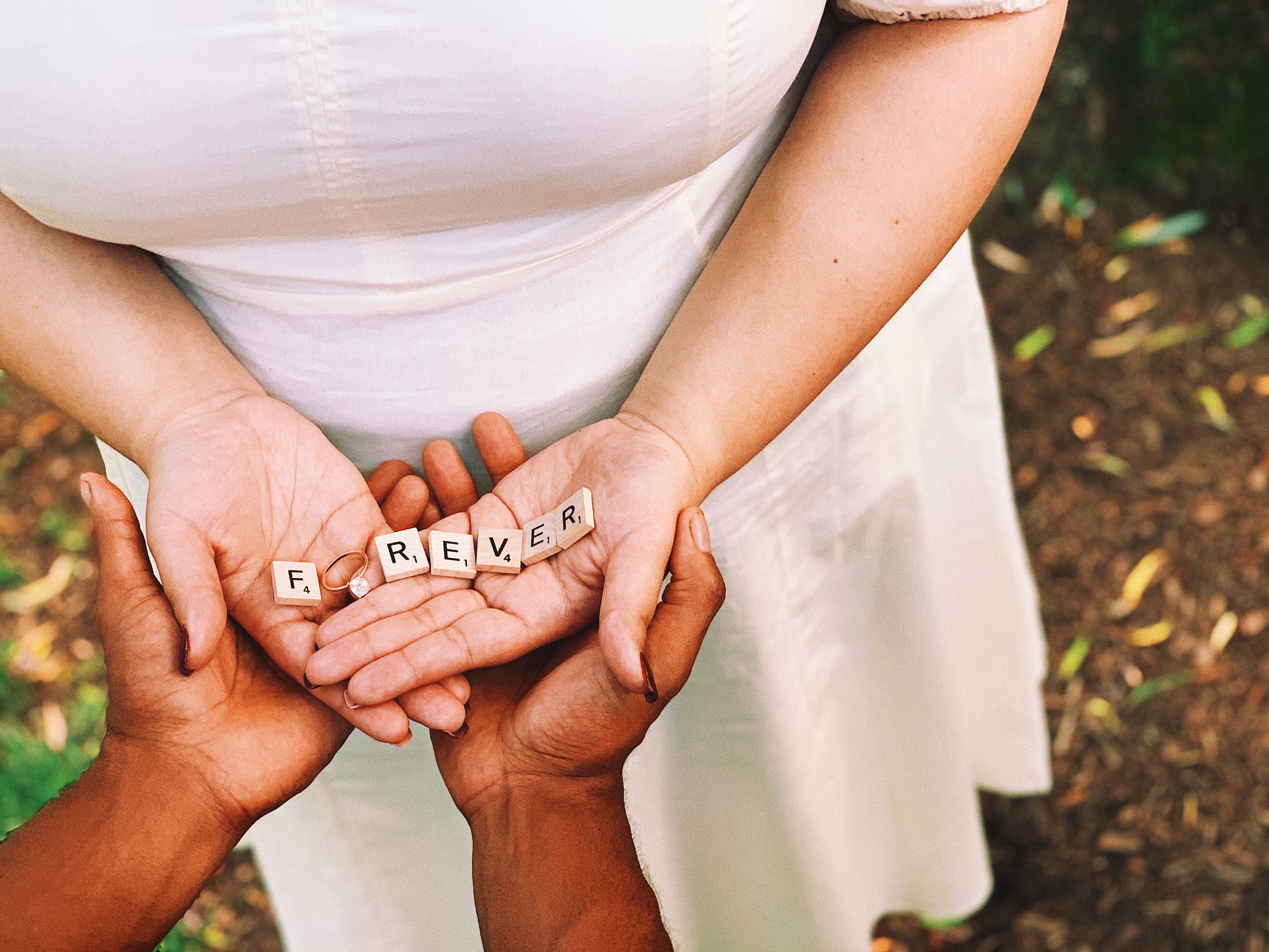 Hands holding Scrabble pieces