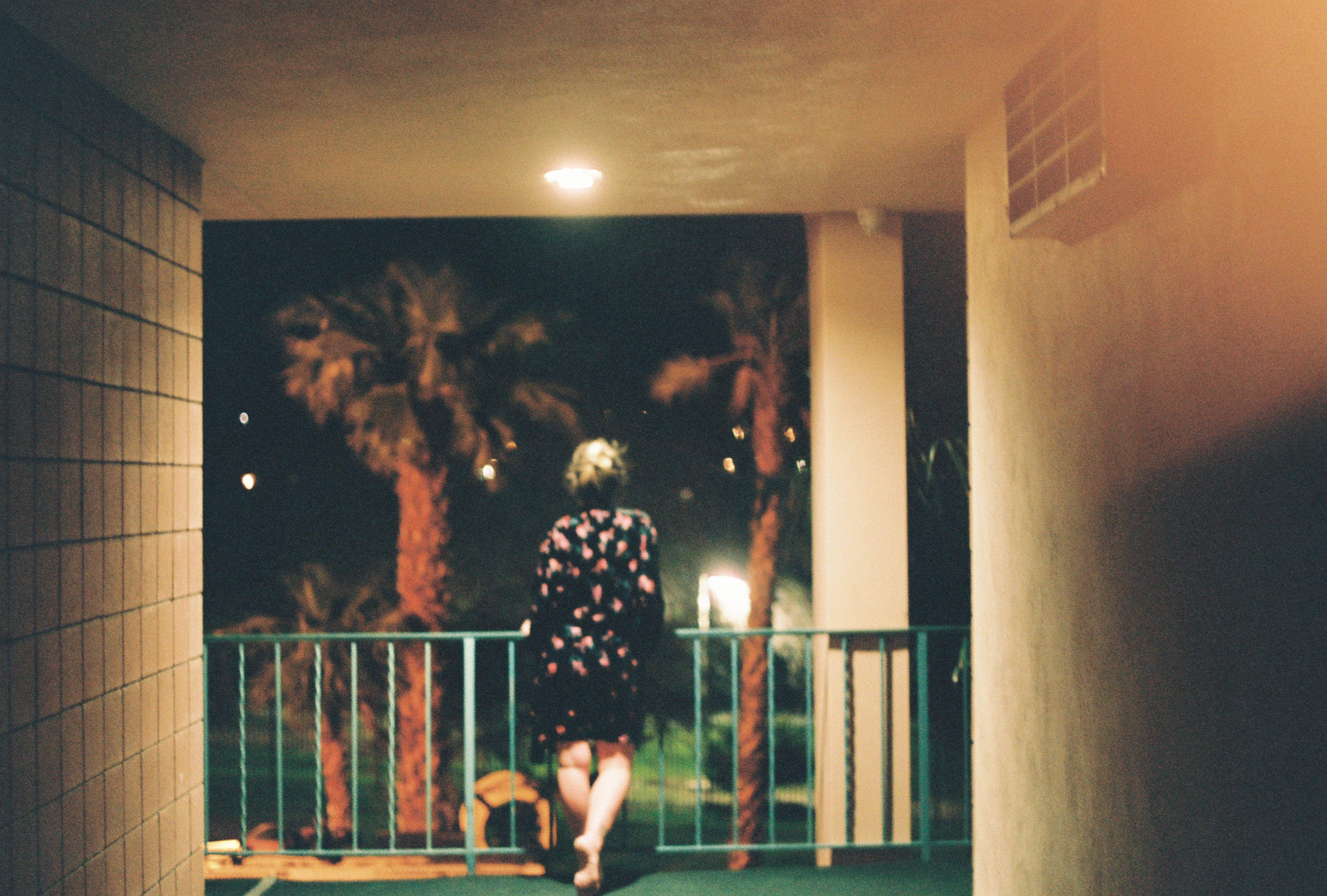 Woman at the end of a dark hallway