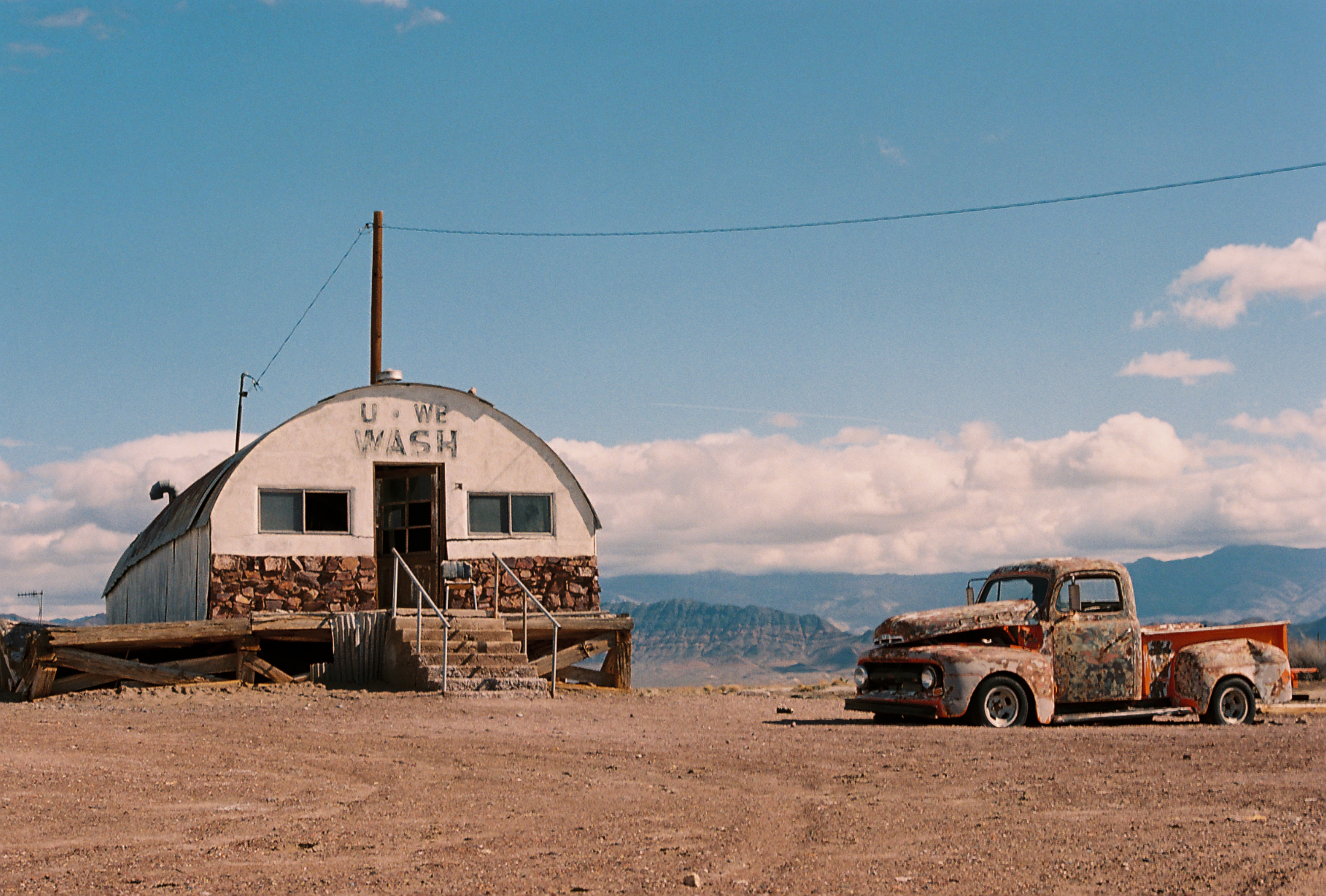 Old truck and building in the desert