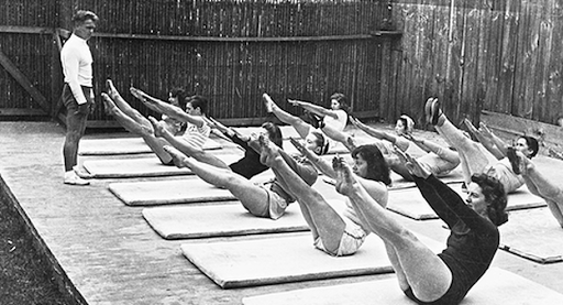 Joseph Pilates teaching a group mat class