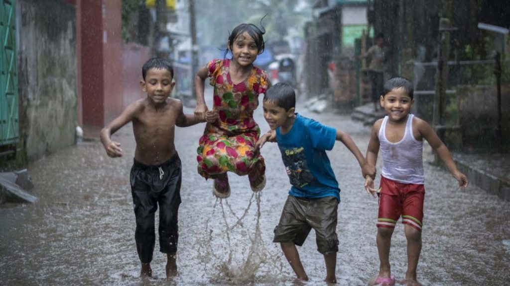 Children playing in the rain in Bangladesh