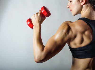 woman holding dumbbell