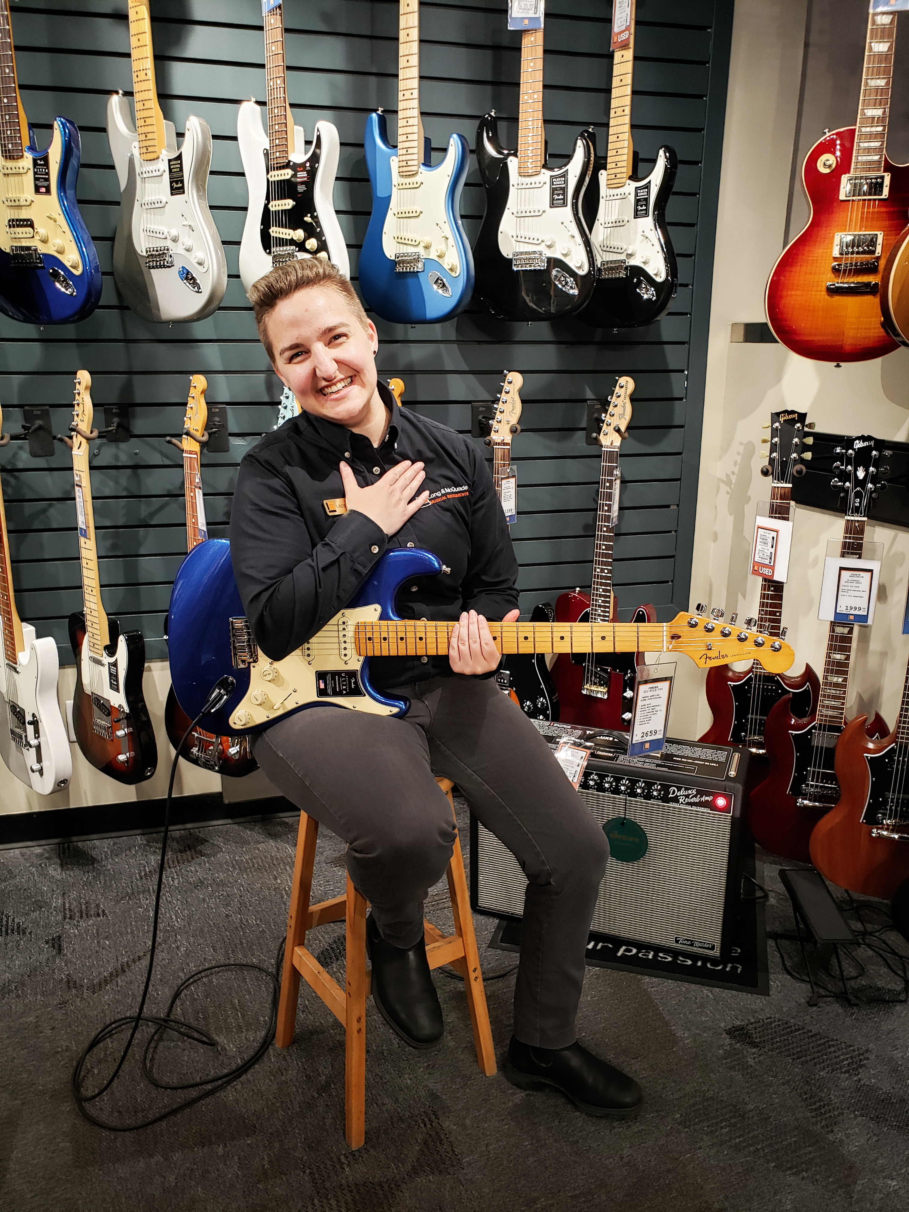 Lindsay with a guitar.