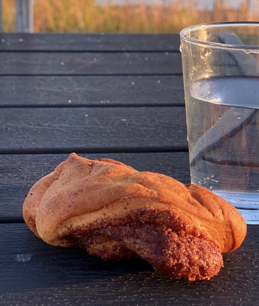 kanelbulle, home-made with view of Swedish west coast harbour