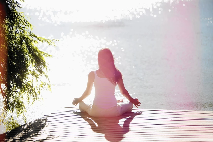 Woman Sitting In a Yoga Position