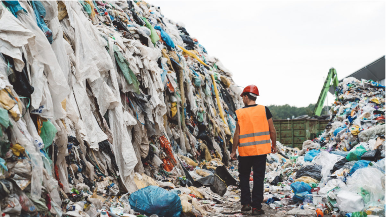 Garbage piles of discarded clothes