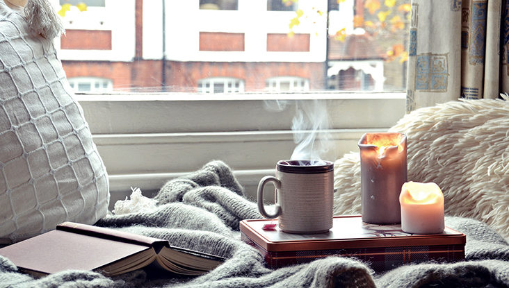 Book, mug and candles