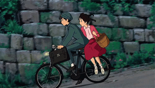 Boy and girl riding on a bike