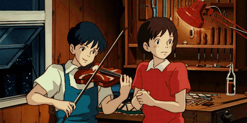 Boy playing 
      violin while girl sings