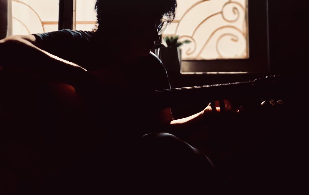 a guy playing guitar