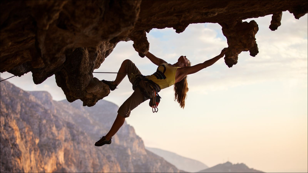 woman rock climbing