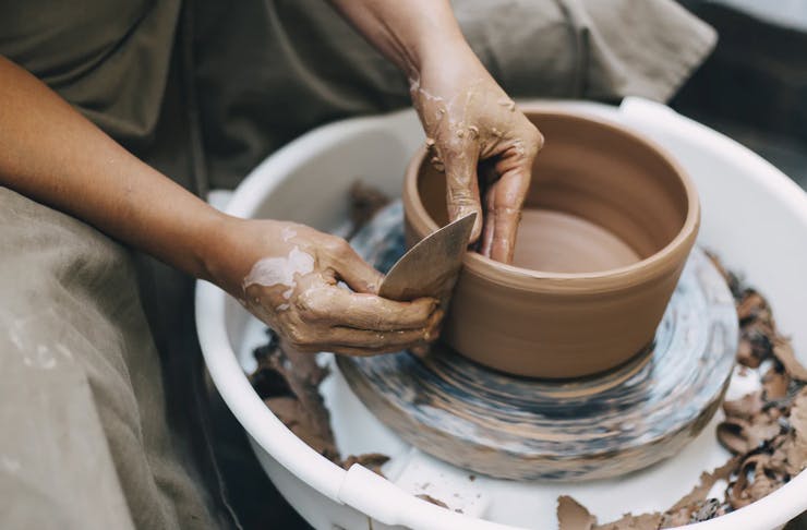 making a pot on the wheel