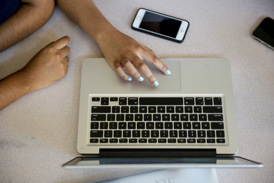 woman coding on laptop