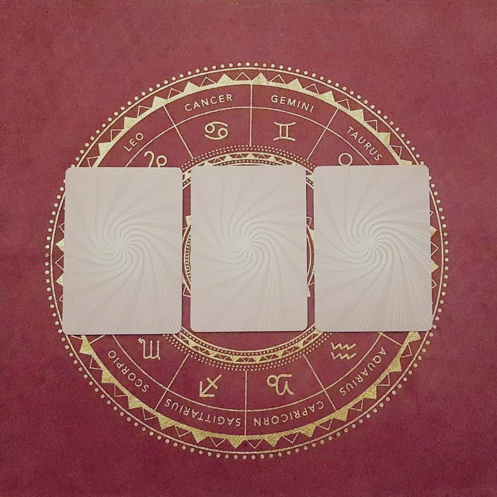 hand pulling out a tarot card