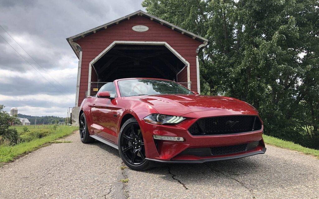 Red Mustang and bridge