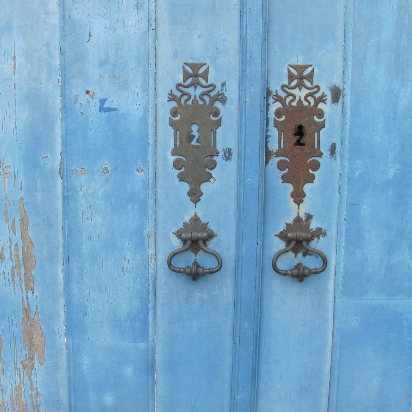 Detail of a very old blue church door