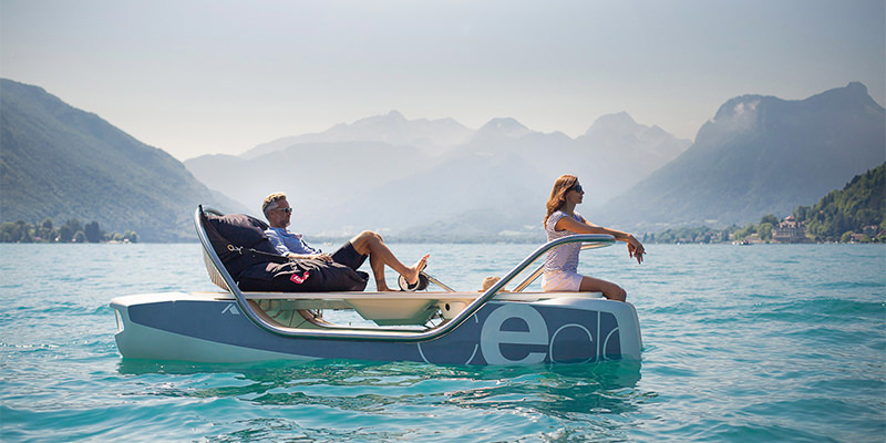 A woman and a man pedalling a Ceclo