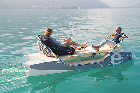 A man and a woman pedalling a Ceclo