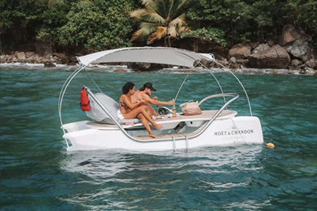 A couple having a picnic on the water on a Ceclo