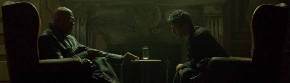 Morpheus and Neo sit at a table