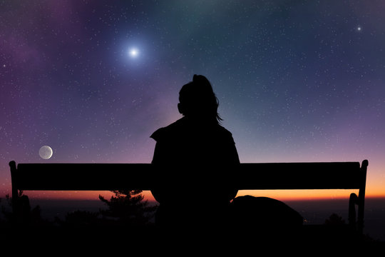 girl looking at bright stars