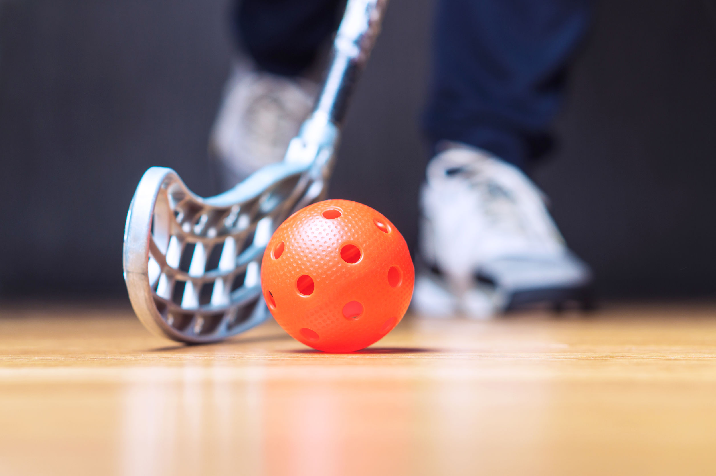 floorball payer with floorball ball