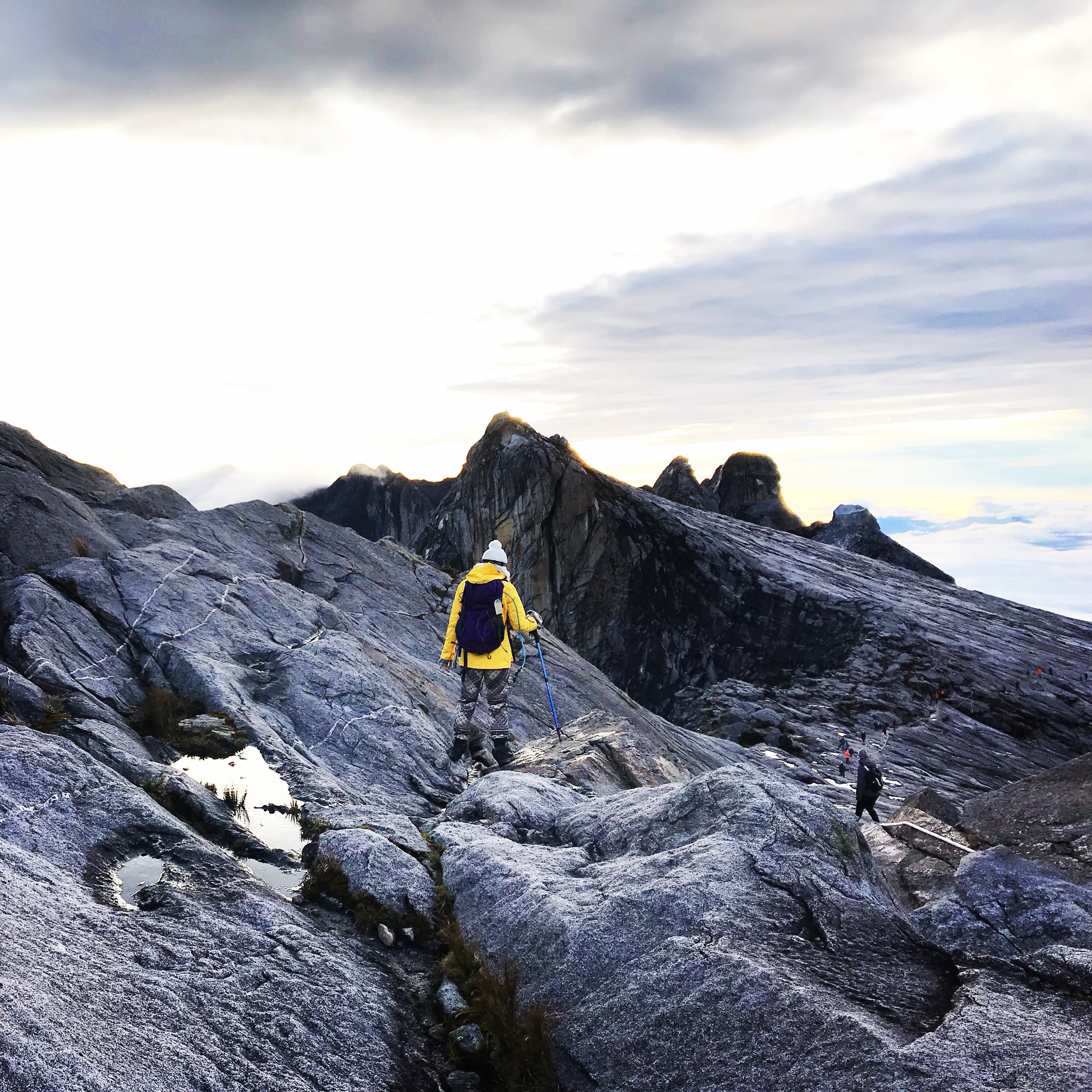 girl walking up mountain