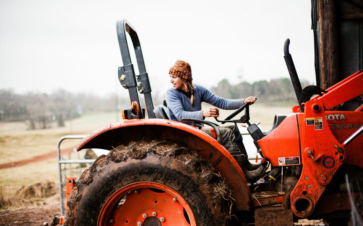 Woman driving tractor