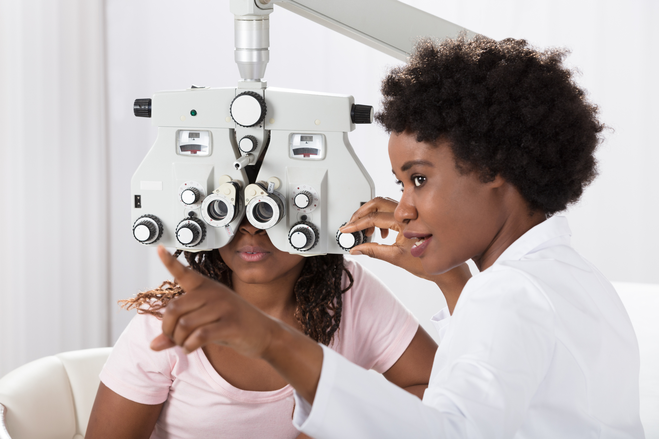 Optometrist with patient