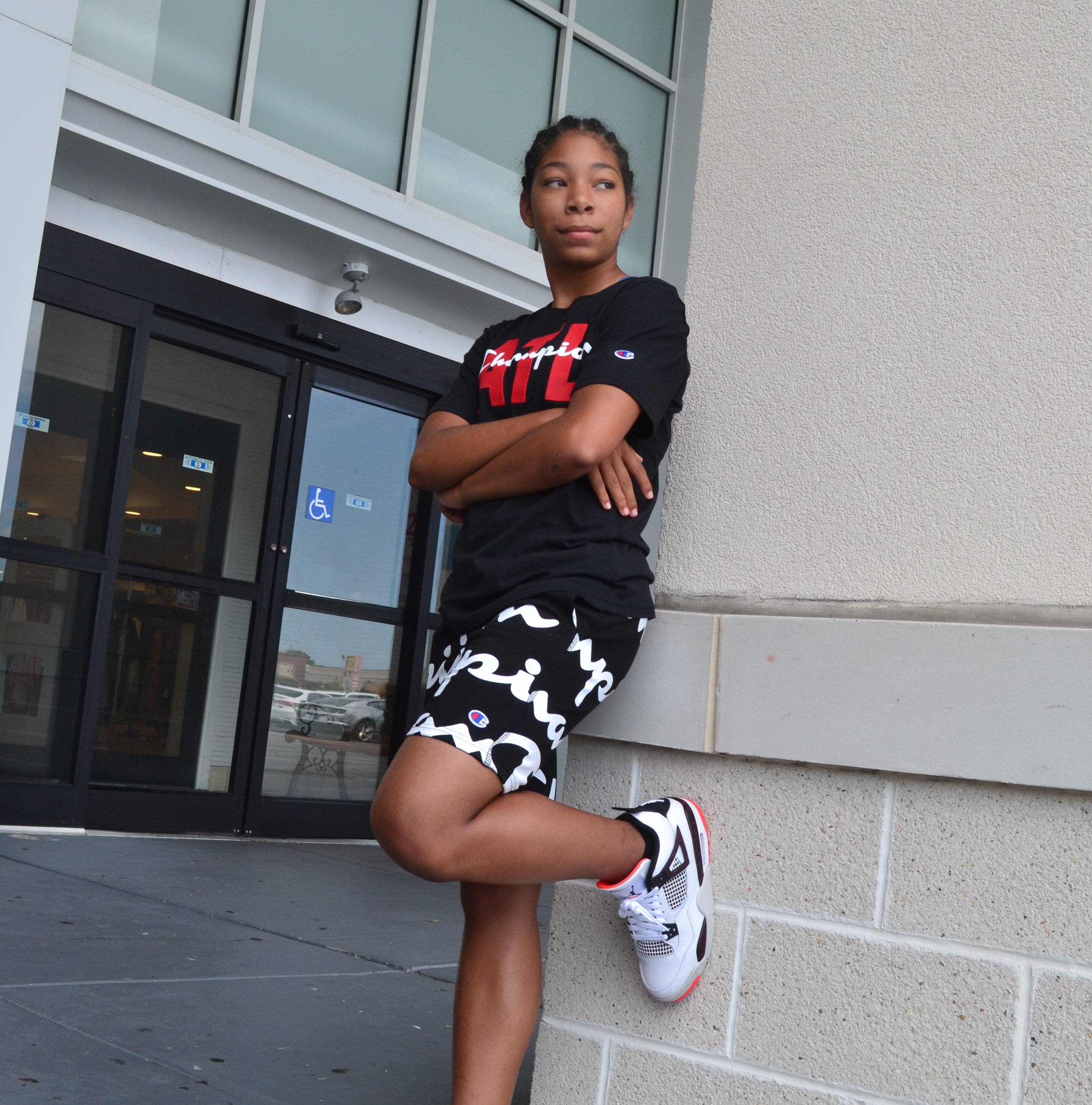 Girl leaning against wall