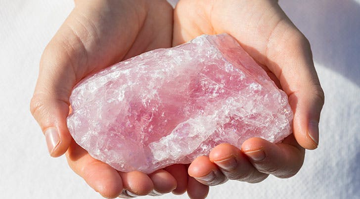  Person holding quartz crystal