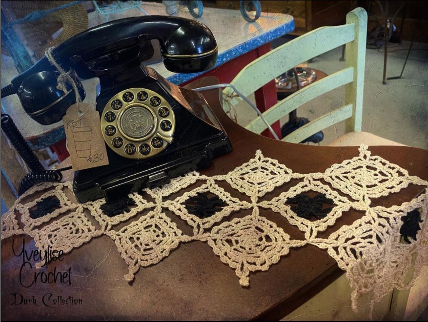 Crochet table runner with spiderweb design