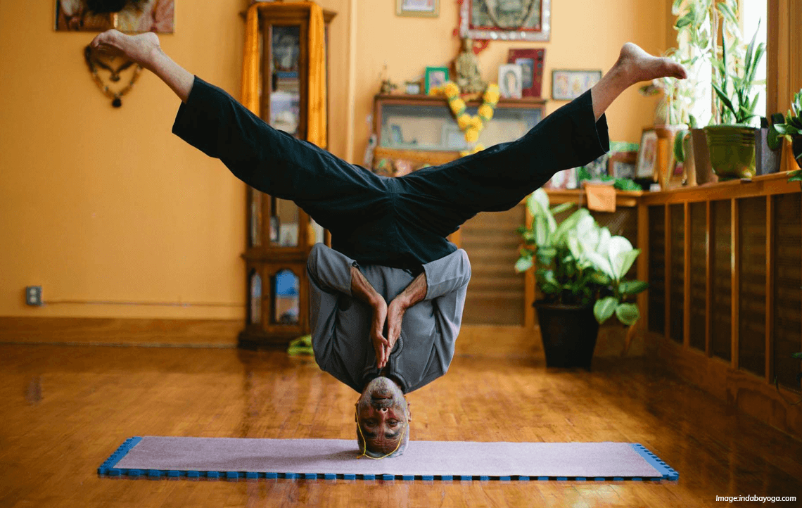 Sri Dharma Mittra doing a headstand