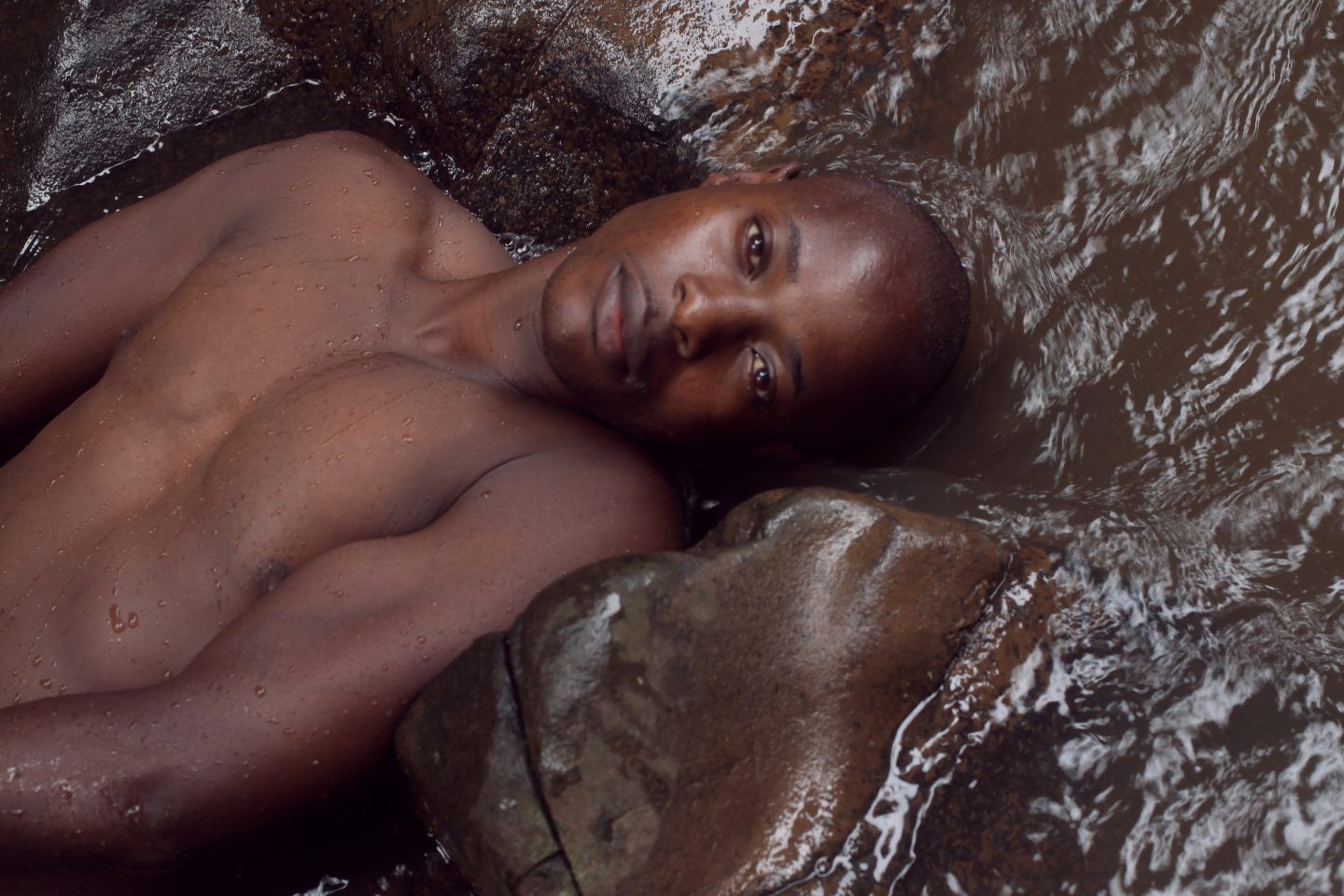 A black mec lying in a river