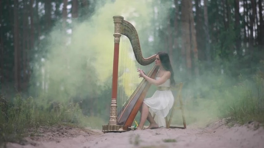 woman playing harp