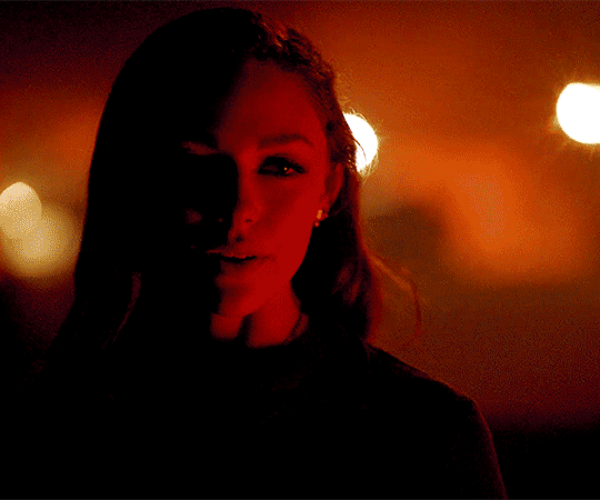 Hope shows her vampire eyes.