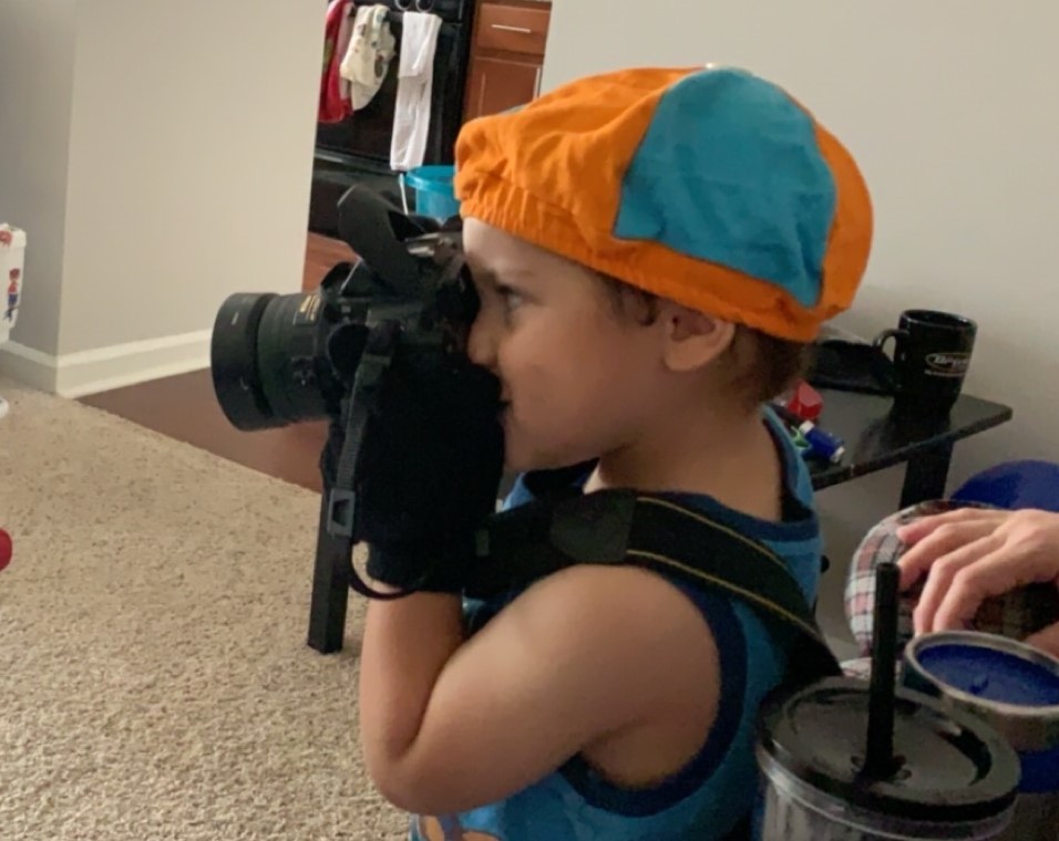 Kid taking photograph