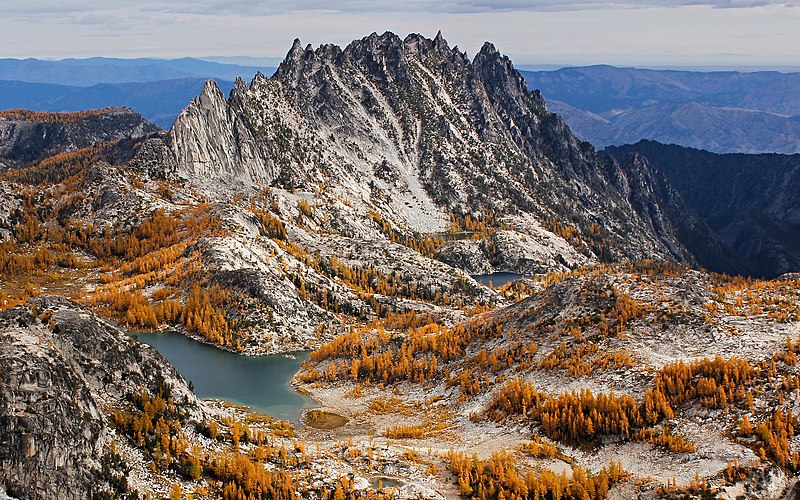 an alpine lake below a mountain range