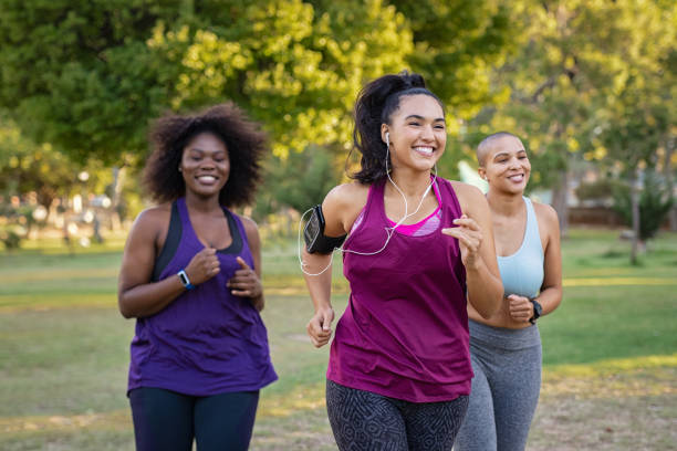 Women enjoying running together in a park