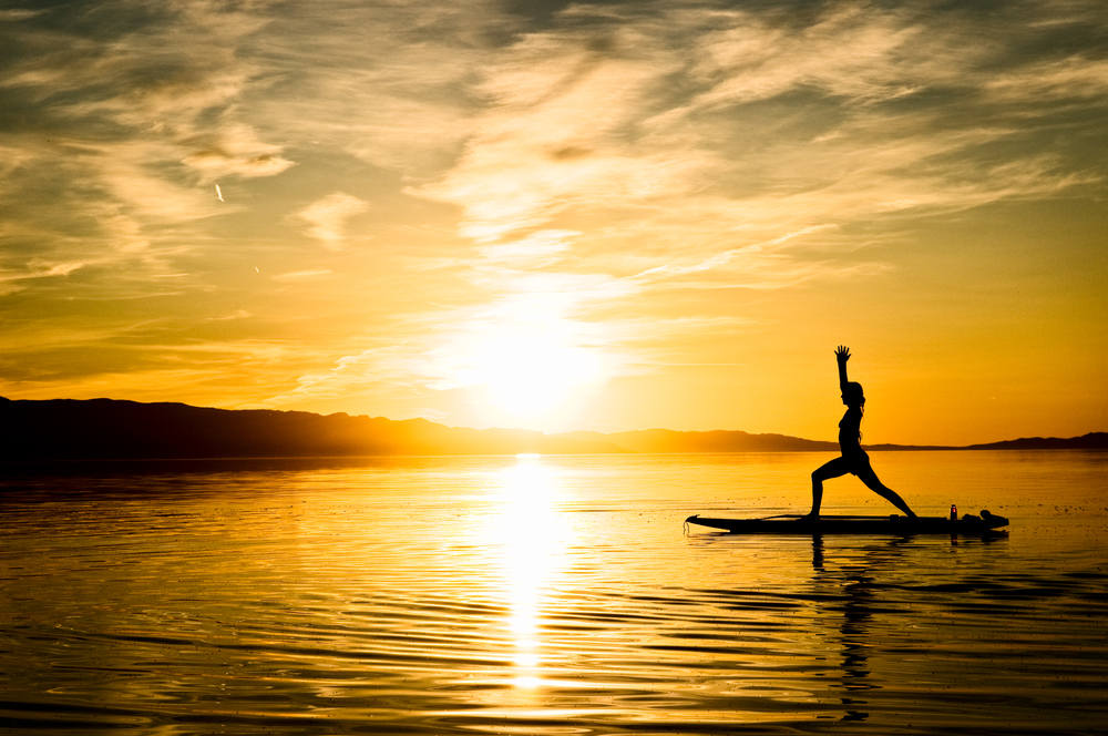 Sup yoga on sun set