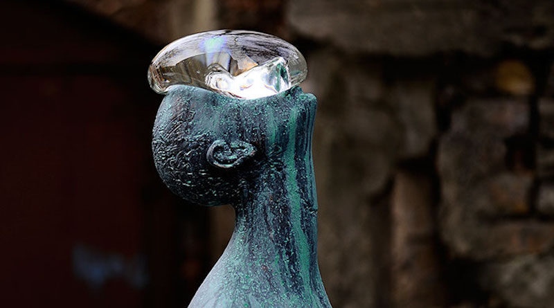 sculpture of a man with a drop on his face