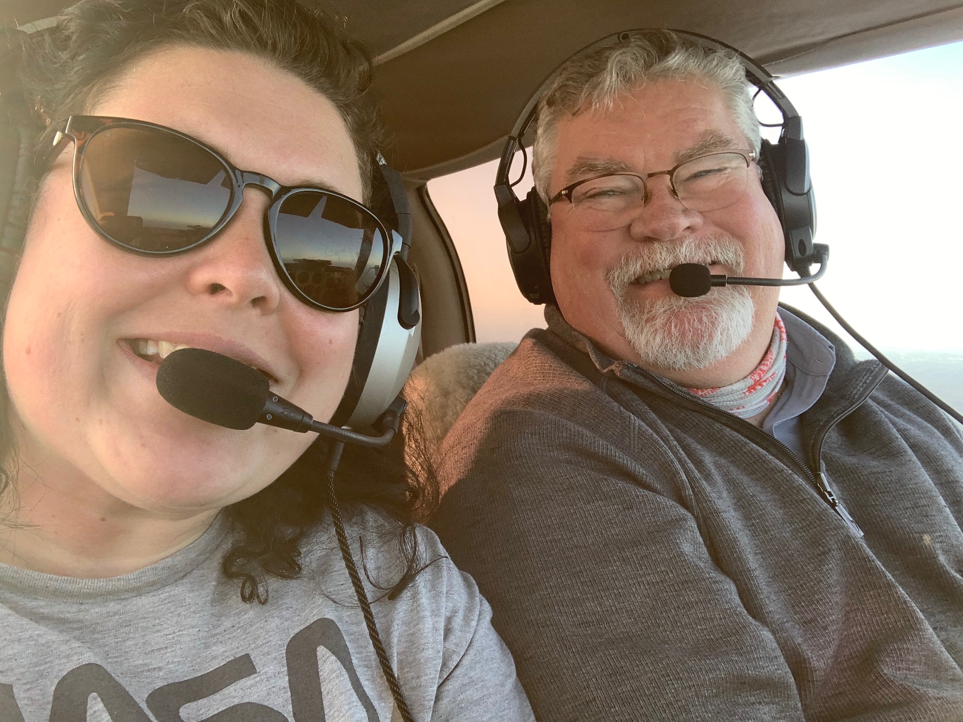 A selfie of my father and I in an airplane.