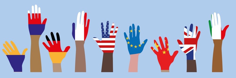 Multi racial hands with different flags painted on them
