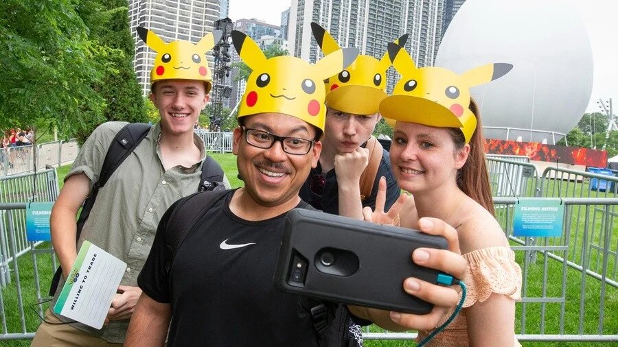 4 people at Go Fest wearing pikachu hats
