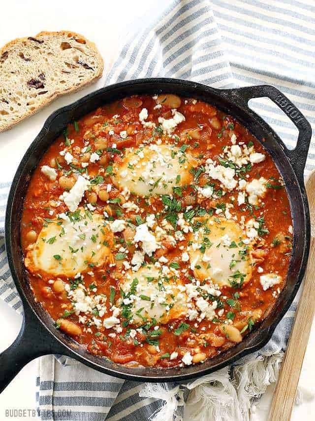 Eggs poached in a rich tomato sauce and topped with crumbled feta cheese