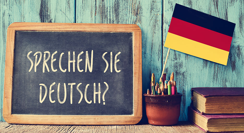 sign on desk saying Sprechen Sie Deutsch?