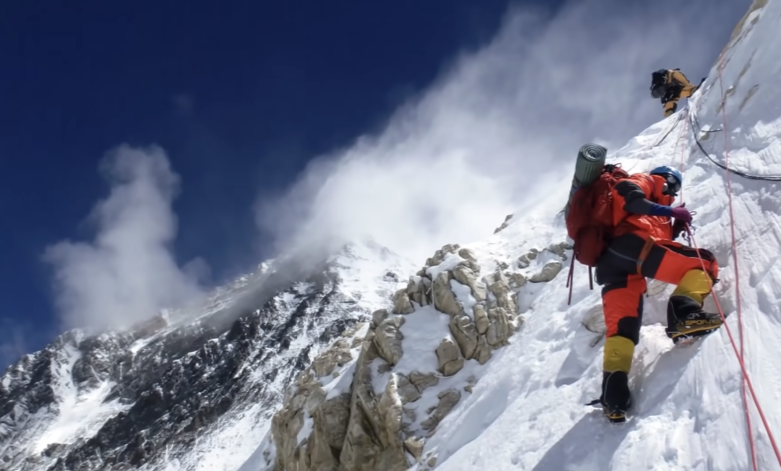 photo from below of mountain climbers on Mount Everest