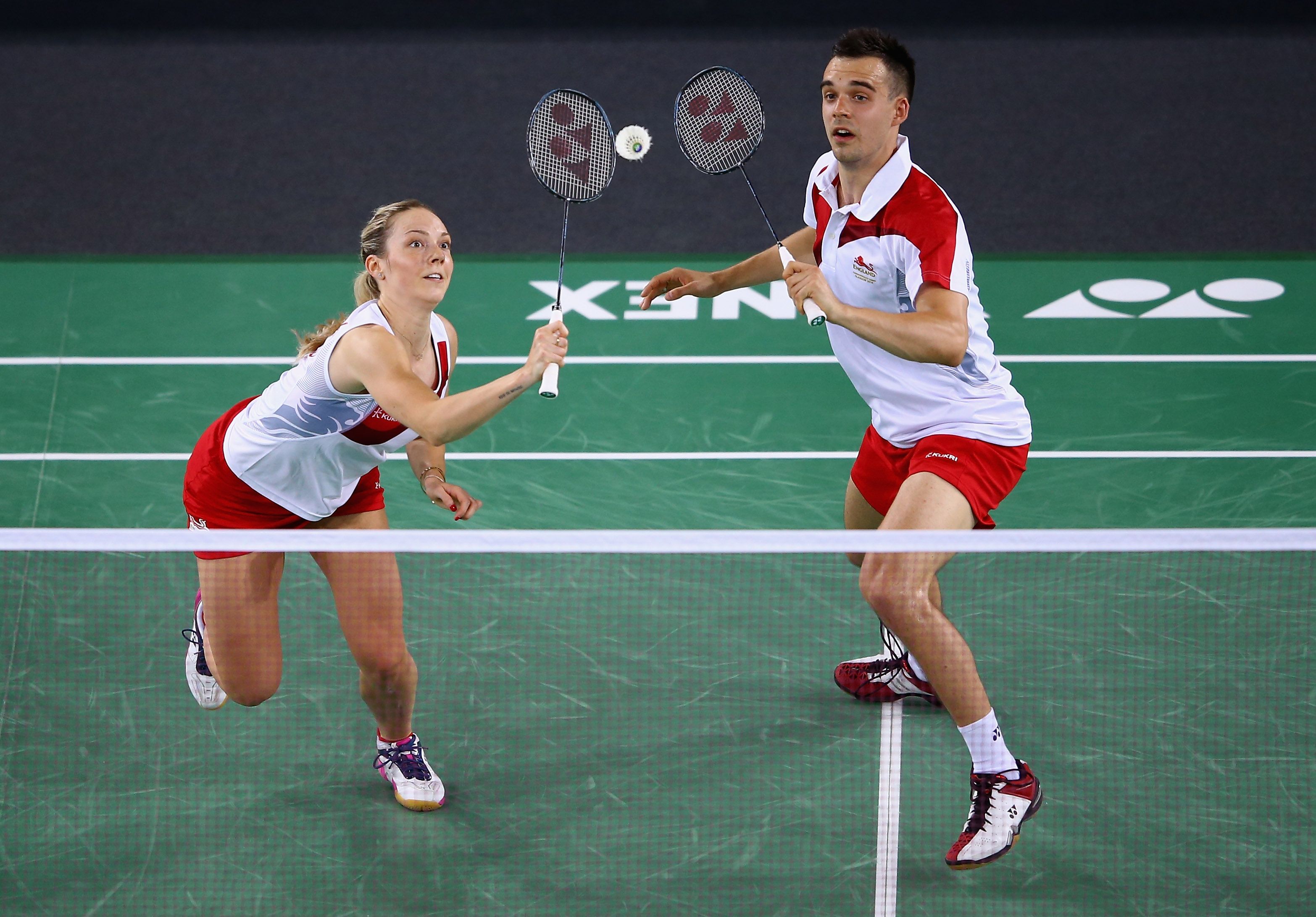 Man and woman playing doubles