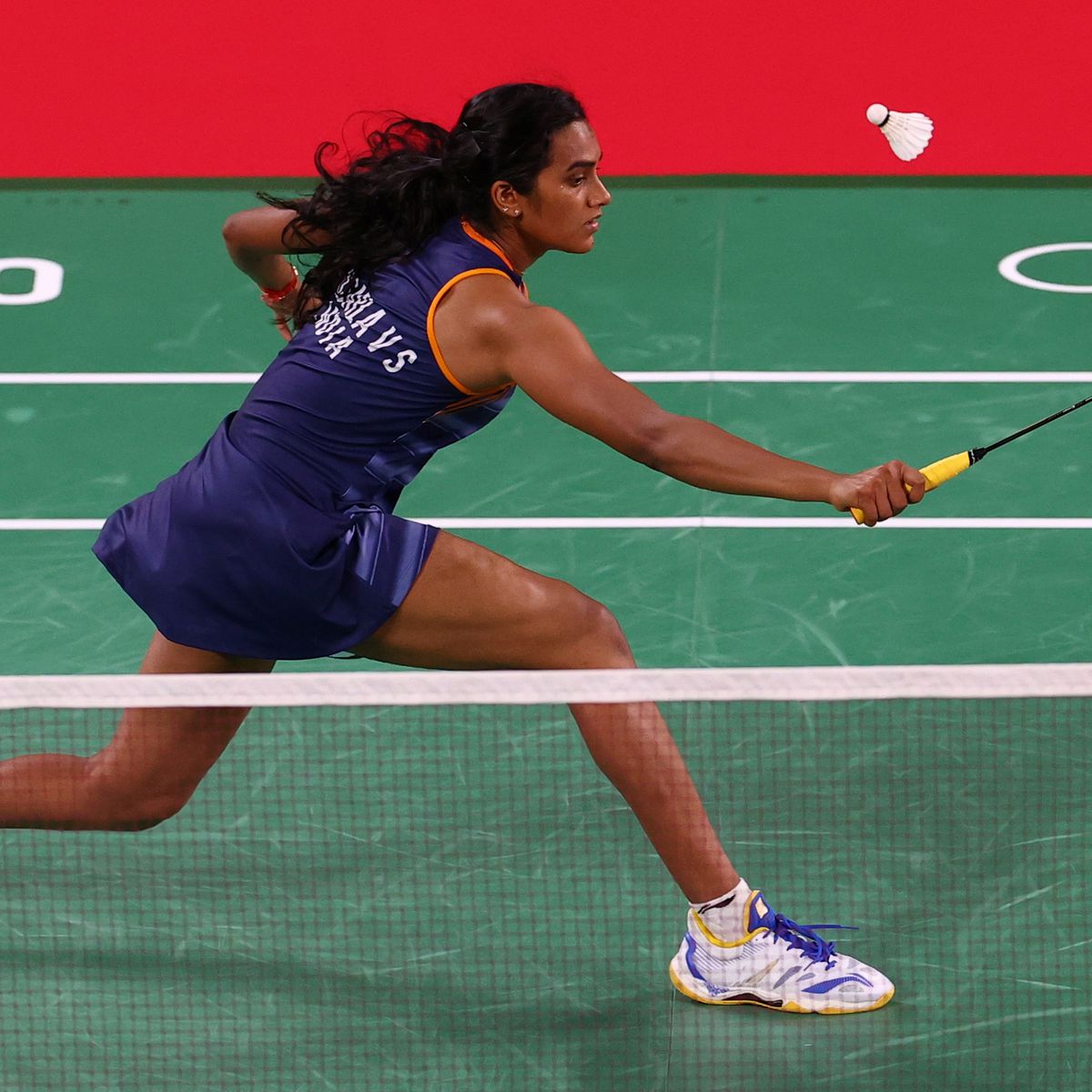 Woman playing singles